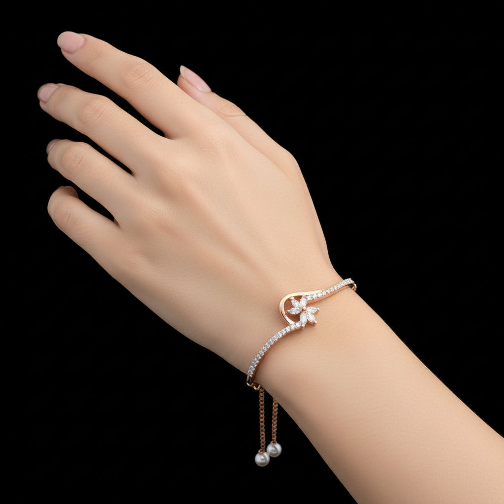 Rose gold bracelet with diamond accents on a dark surface, branded 'SAHELI'.