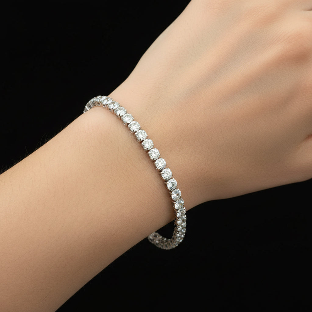 Pearl bracelet on a dark reflective surface