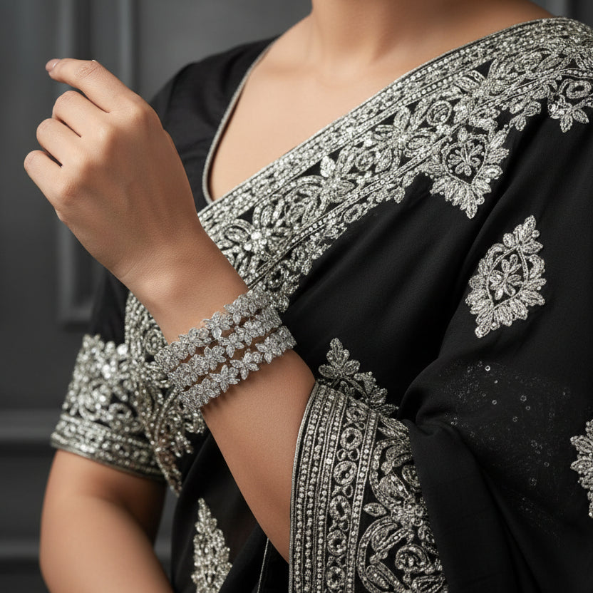 Silver beaded bracelet on a dark background