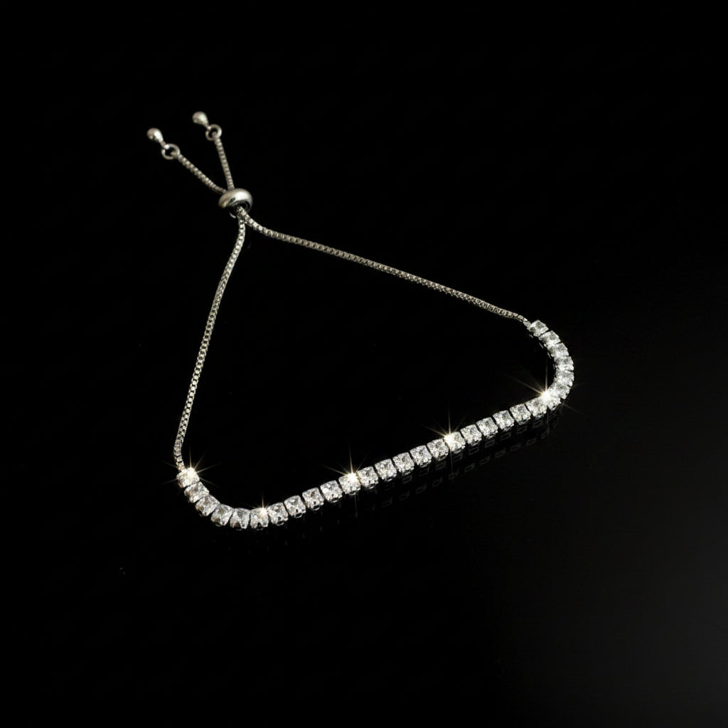 Silver beaded bracelet on a black background