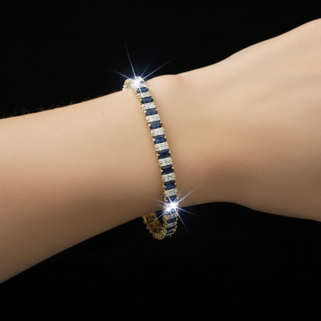 Gold bracelet with blue stones on a black background
