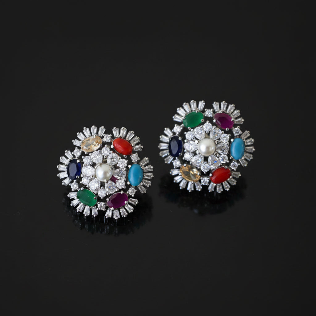 Pair of colorful gemstone earrings on a dark background