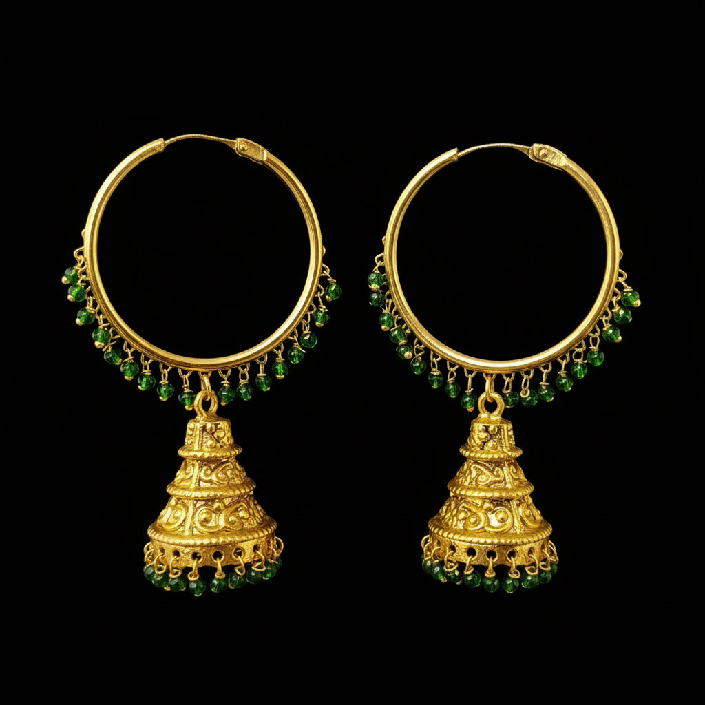 Gold hoop earrings with green beads and jhumkas on a gray background, featuring the brand 'Saheli'.