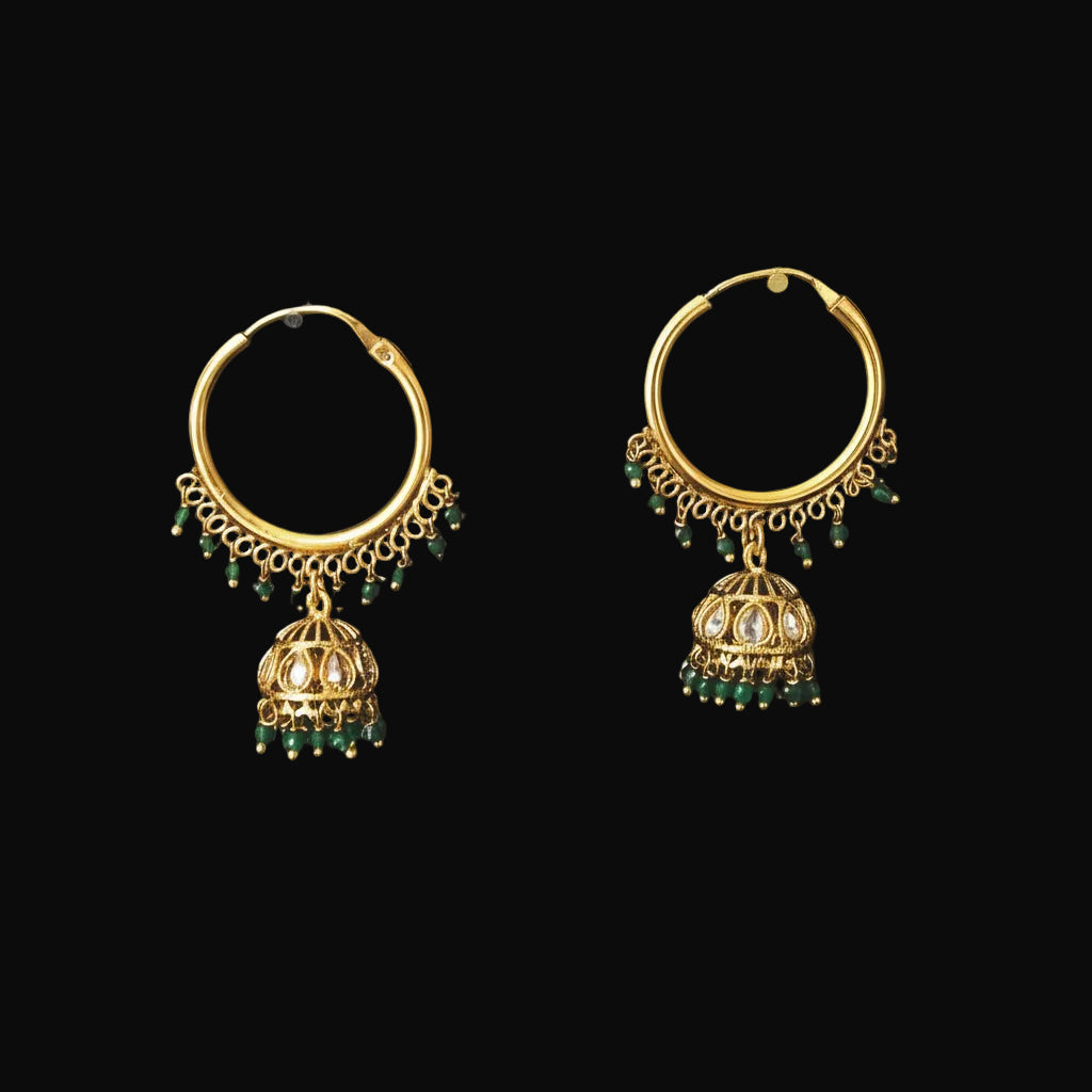 Gold hoop earrings with green beads on a black background, featuring the brand 'SAHELI'.