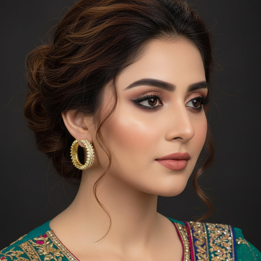 Gold ring with diamonds on a dark background, featuring the brand 'Saheli'.