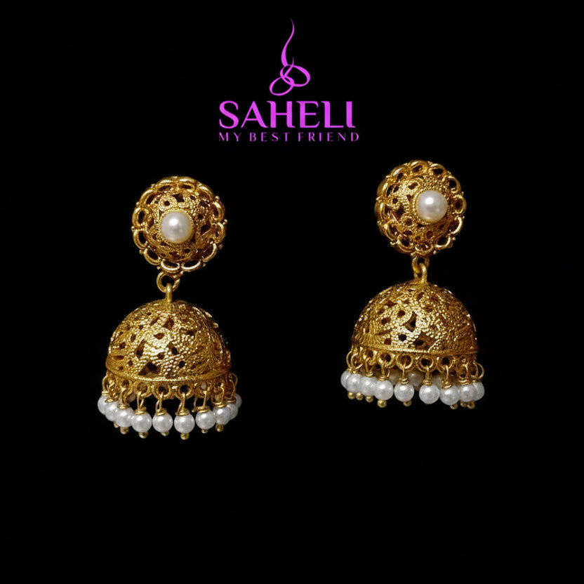 Gold earrings with pearls on a black background, featuring the brand 'Saheli'.