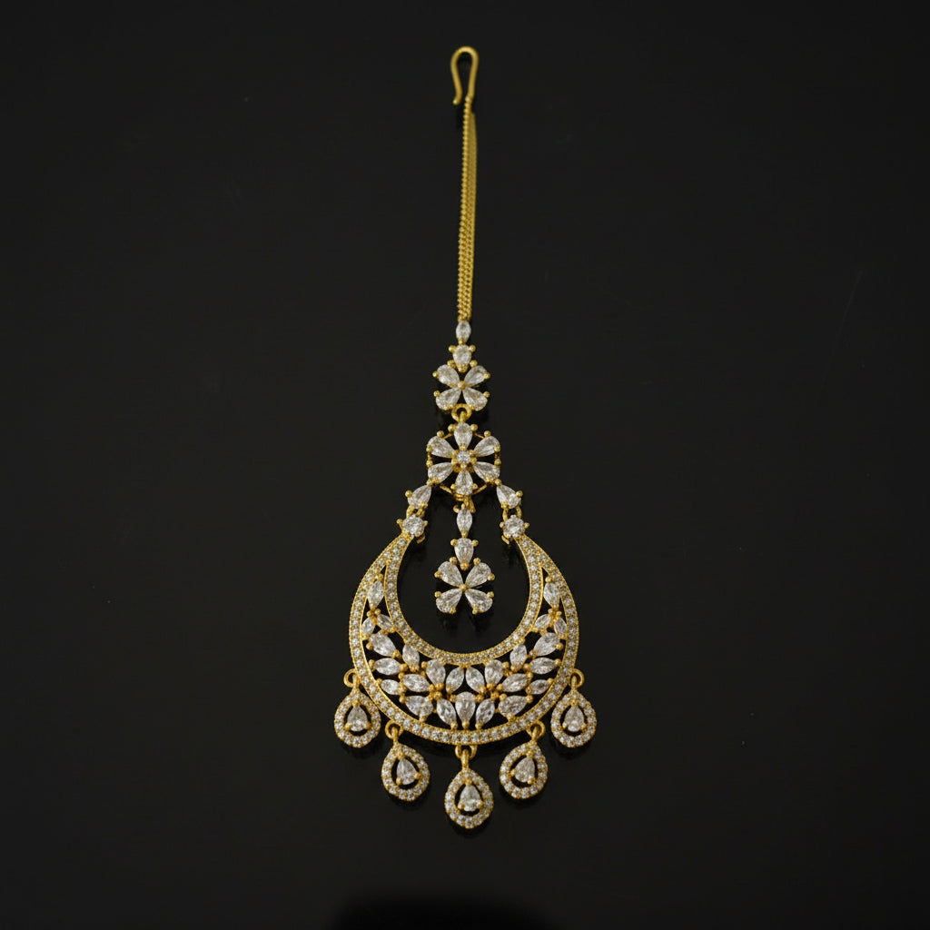 Gold decorative hairpin with intricate designs on a black background