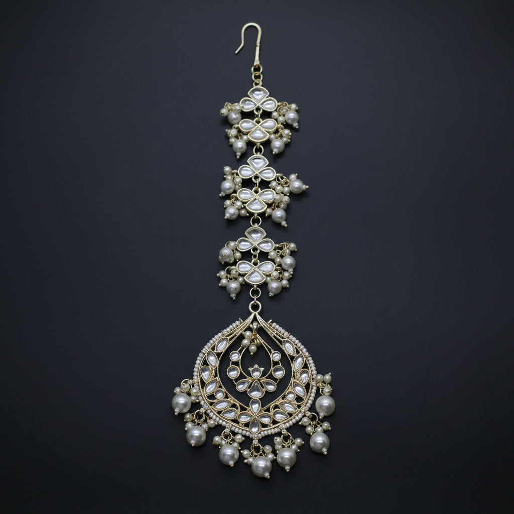 Ornate necklace with pearls on a dark background