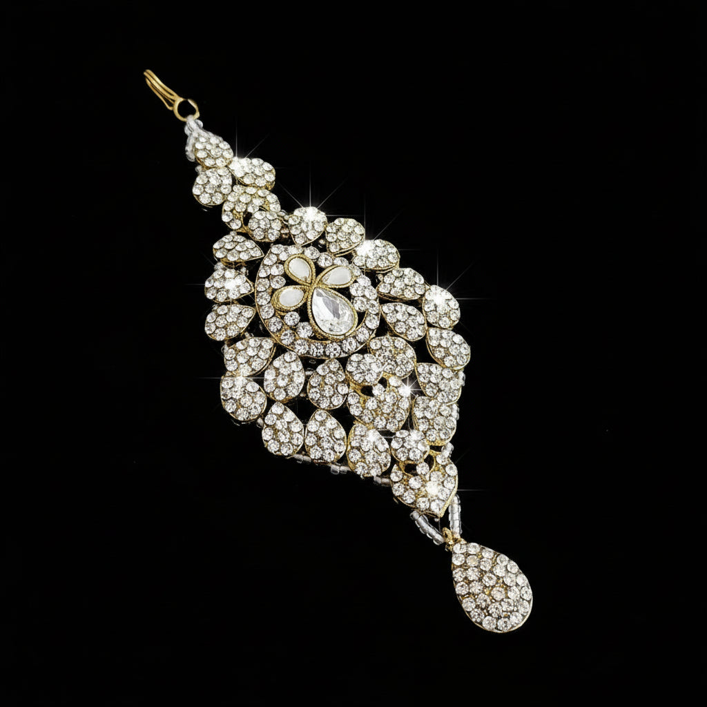 Ornate diamond and pearl pendant on a dark background with 'SAHELI' branding.
