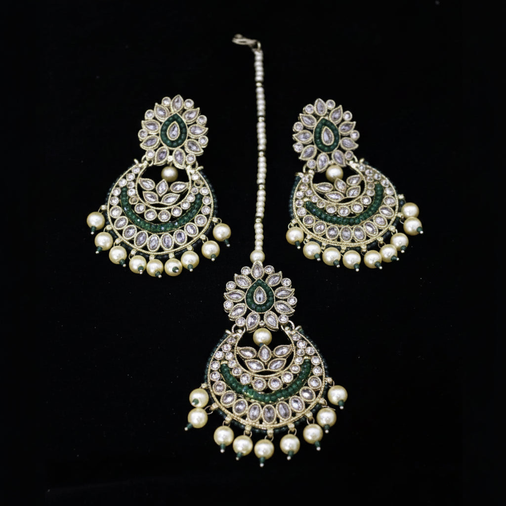 Jewelry set with earrings and a necklace on a black background