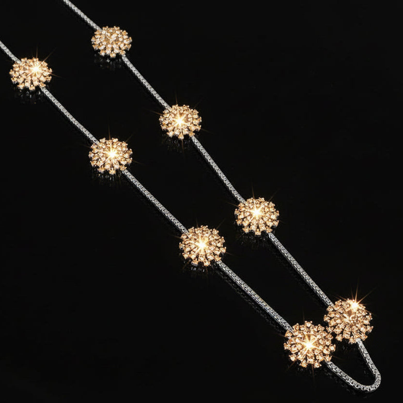 Silver necklace with floral pendants on a black background