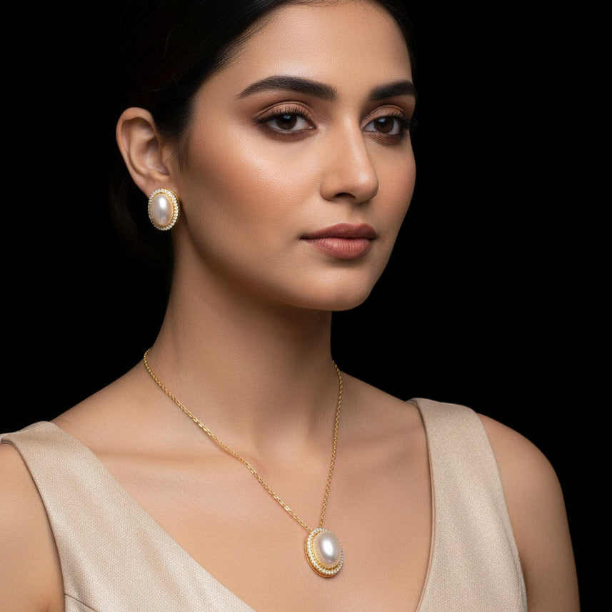 Jewelry set with necklace and earrings on a black background, featuring the brand 'Saheli'.