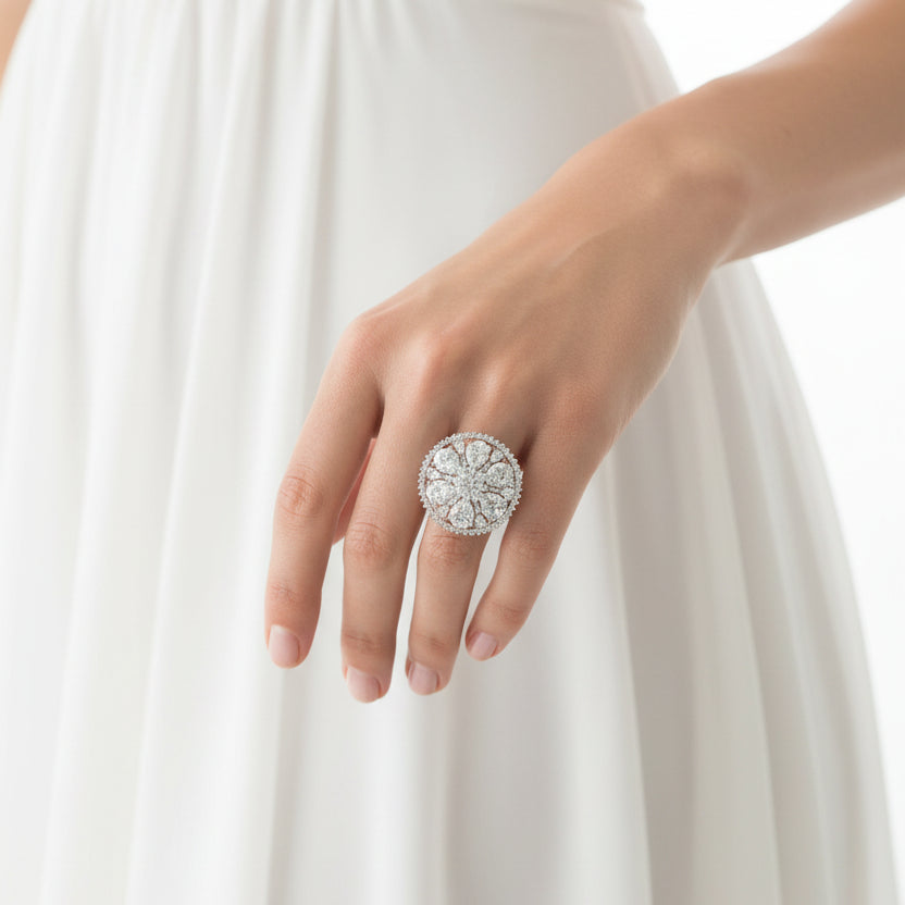 Diamond ring on a black mannequin hand against a dark background