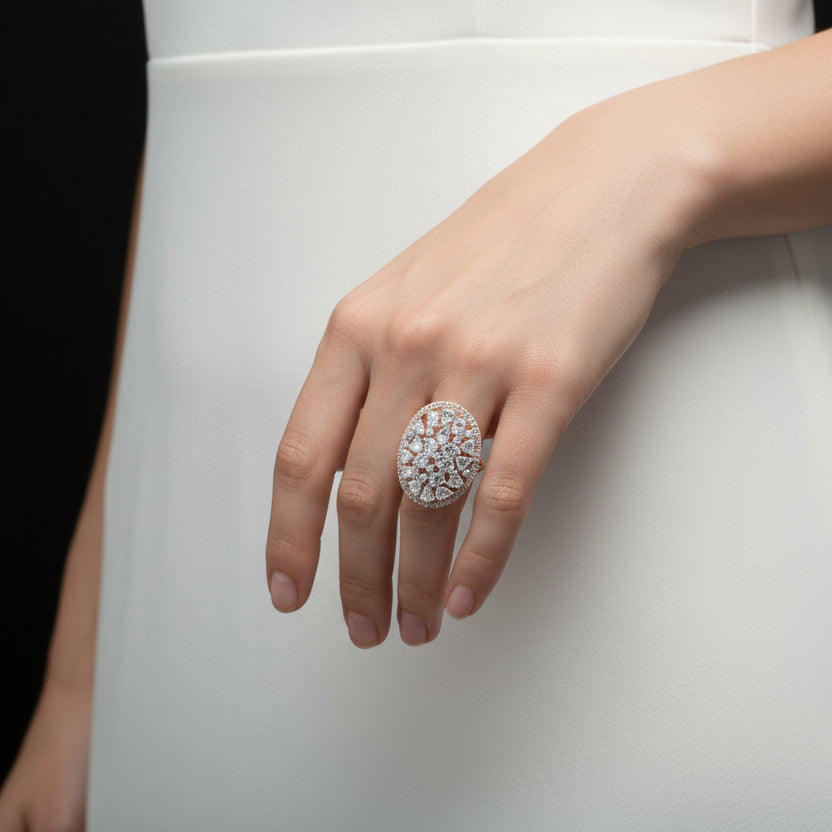 Diamond ring on a reflective surface with 'SAHELL' branding.