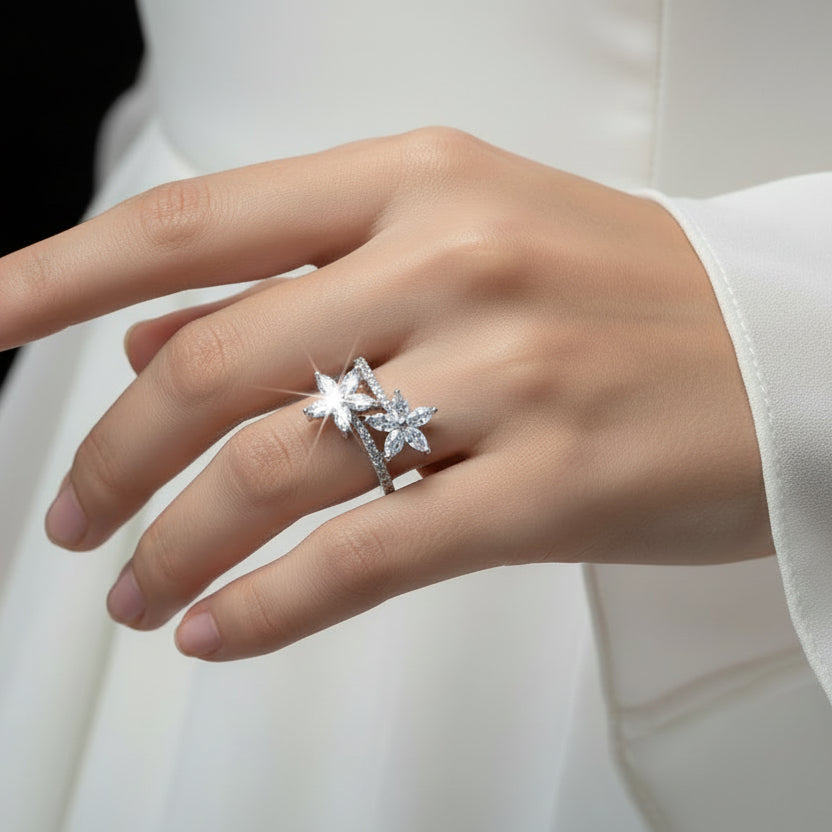 Diamond earring on a black gloved hand with 'SAHELI' branding.