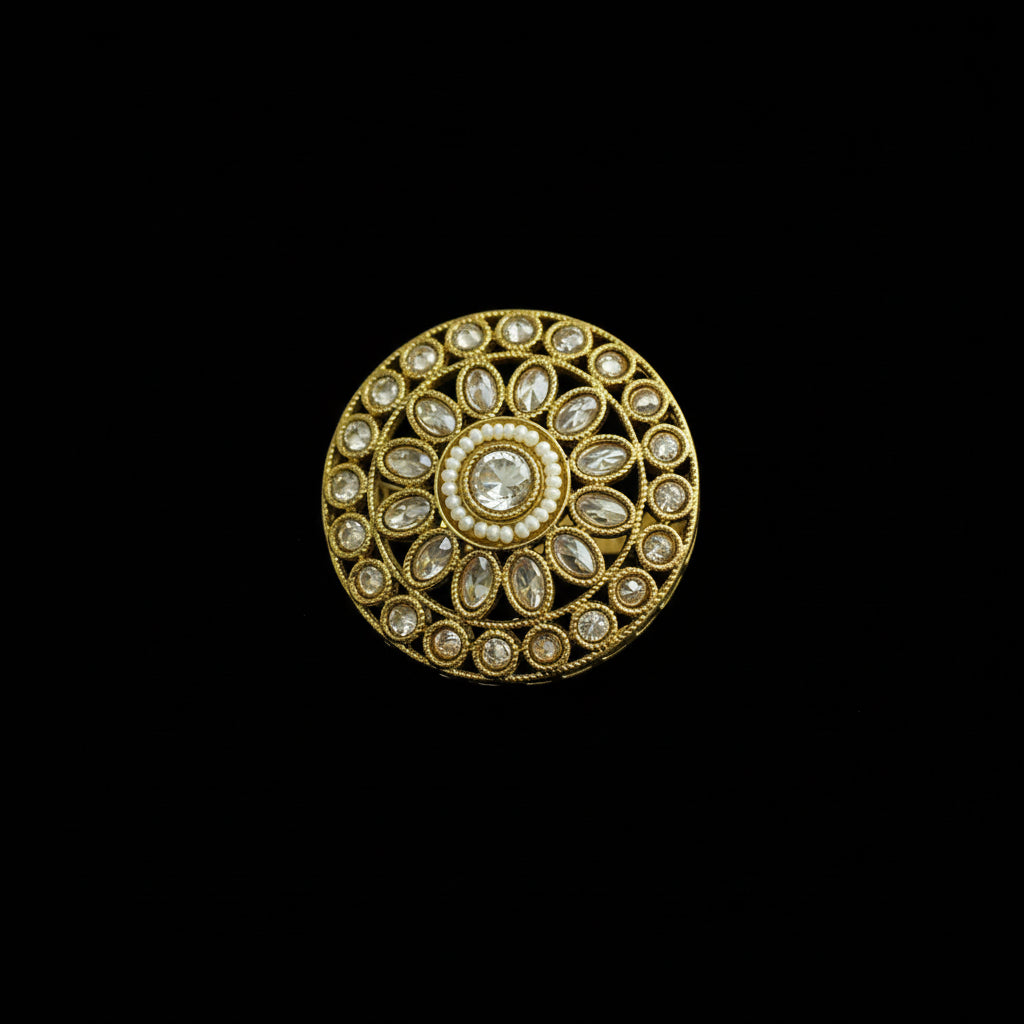 Decorative gold ring with gemstones on a black background