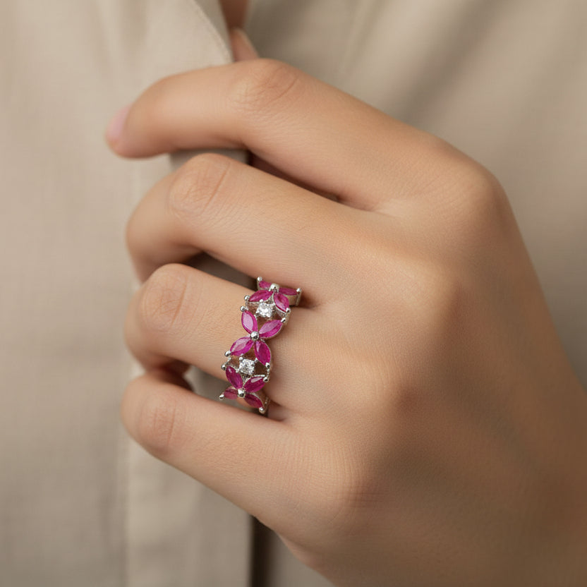 Ring with pink gemstones on a black mannequin hand, branded 'Saheli My Best Friend'.