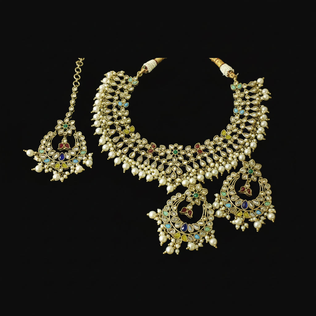Ornate necklace set with earrings on a dark background, featuring the brand 'Saheili'.
