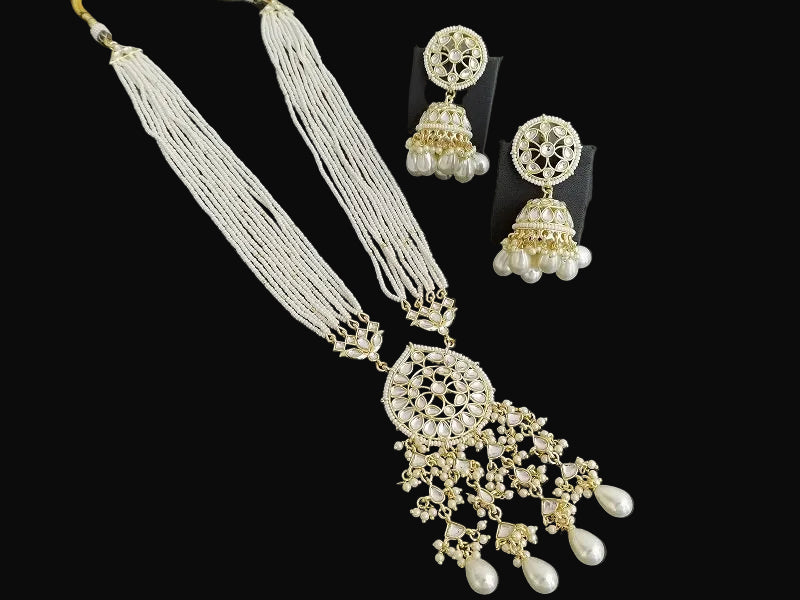 Jewelry set with necklace and earrings on a black background