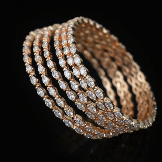 Set of diamond-studded bangles on a black stand with 'Saheli' branding.