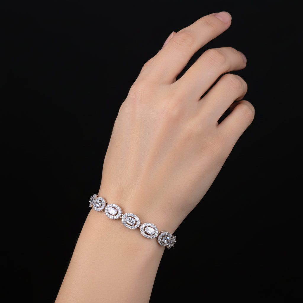 Silver bracelet with intricate design on a black background, featuring the brand 'SAHELI'.