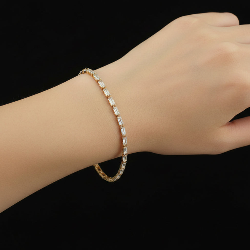 Gold bracelet with diamond-like stones on a black background