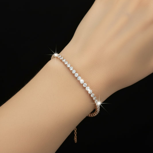 Pearl bracelet with gold clasp on a black background