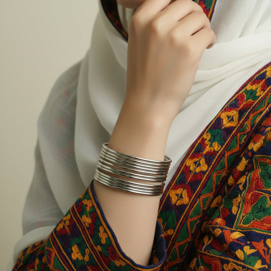 Coiled white cable on a black stand against a dark background