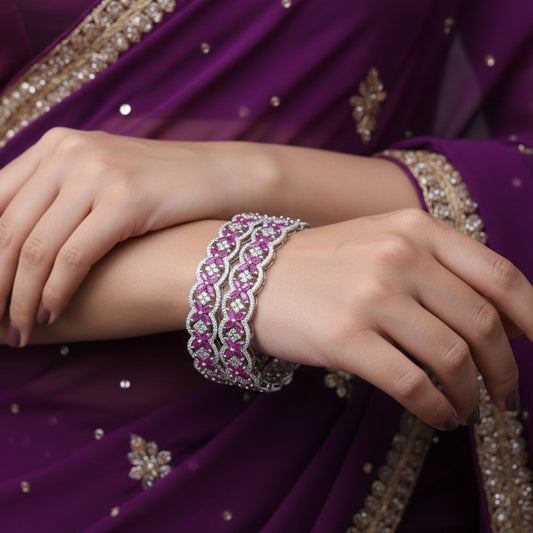 Decorative headband with pink and silver design on a black background, featuring the brand 'SAHELI'.