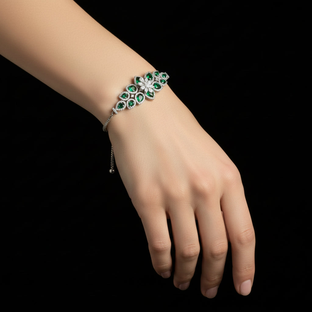 Necklace with green gemstones on a black background