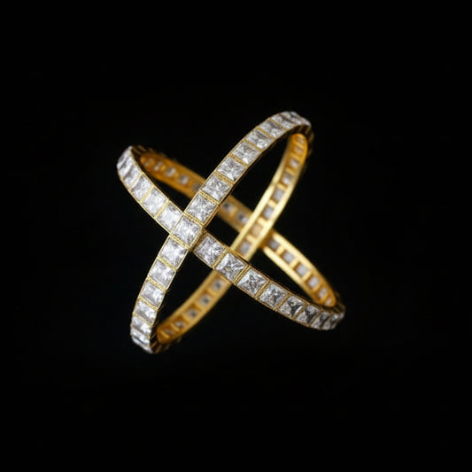 Two diamond bracelets on a gray cushion with 'SAHELI' branding.