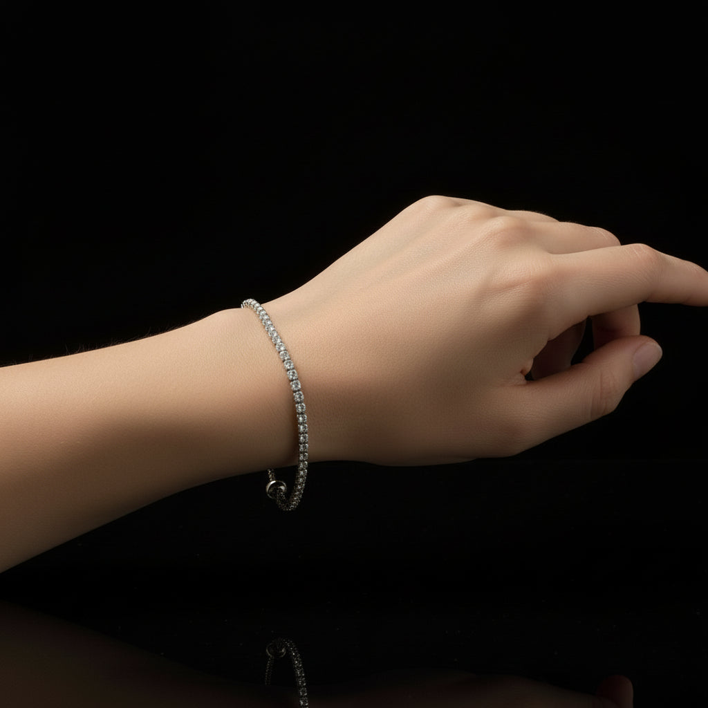 Silver bracelet with clear stones on a black background