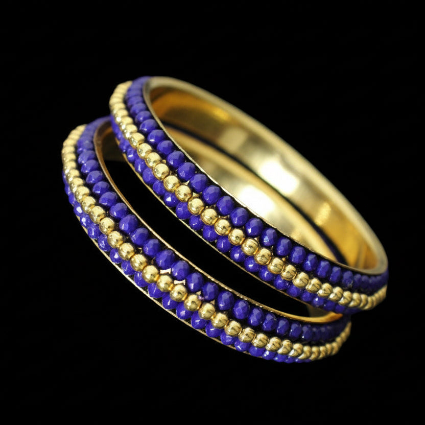 Gold and purple beaded ring on a gray background with 'Saheli' branding.