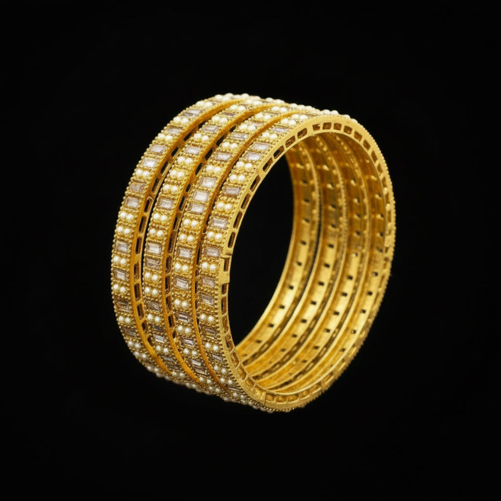 Set of gold bangles with 'Saheli' branding on a reflective surface.