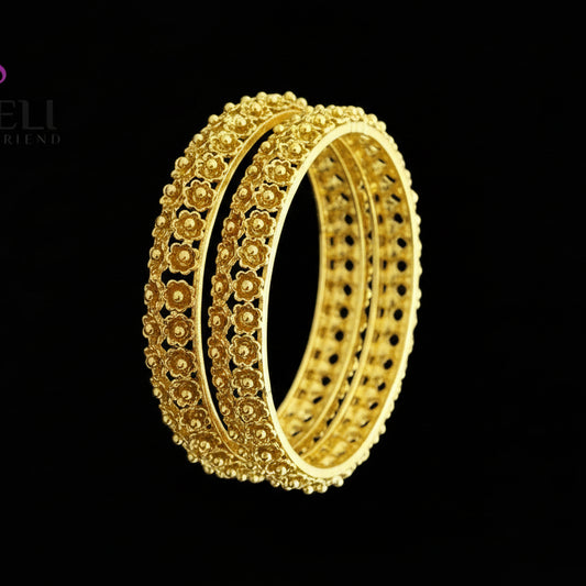 Gold bangles on a gray background with 'SAHELI' branding.