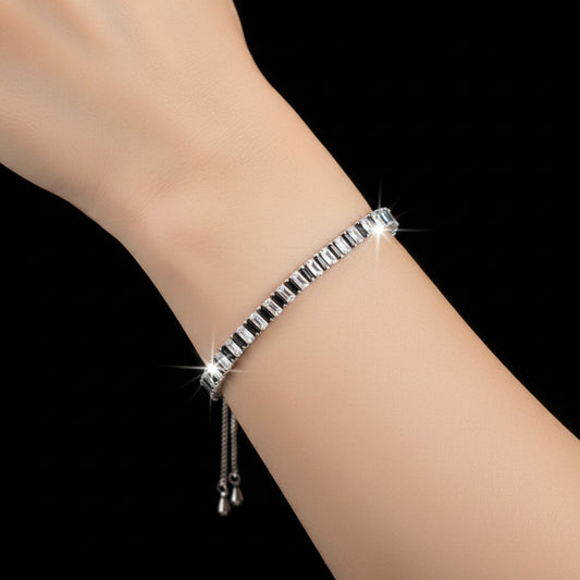 Silver bracelet on a dark gray background