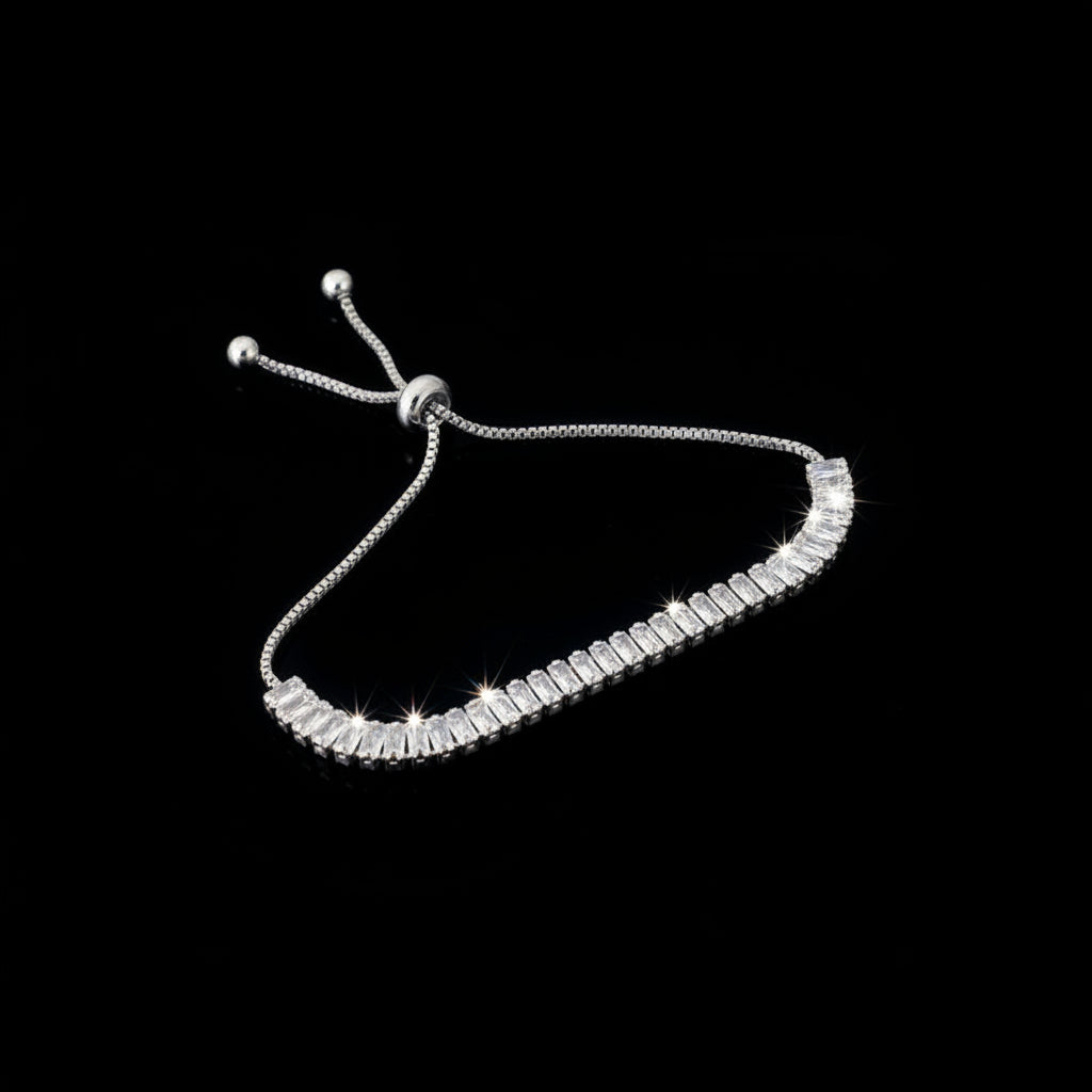 Silver necklace with clear stones on a dark gray background