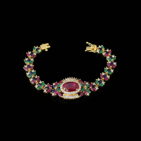 Colorful gemstone bracelet with gold accents on a dark background, featuring the brand 'Saheli'.