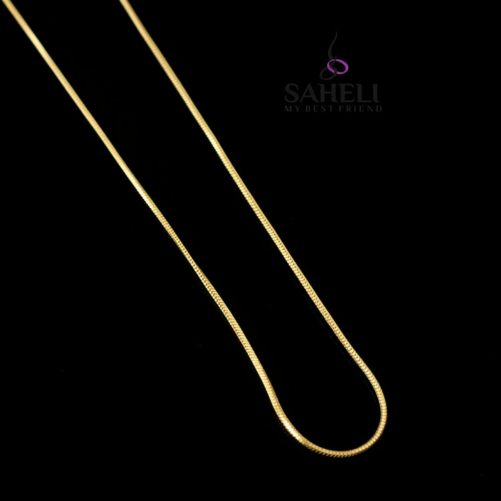 Gold chain on a dark gray background with 'SAHELI' branding.