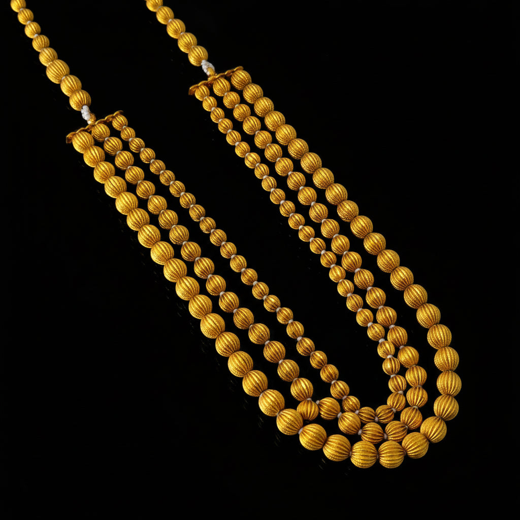 Gold necklace with 'SAHELI' branding on a dark background