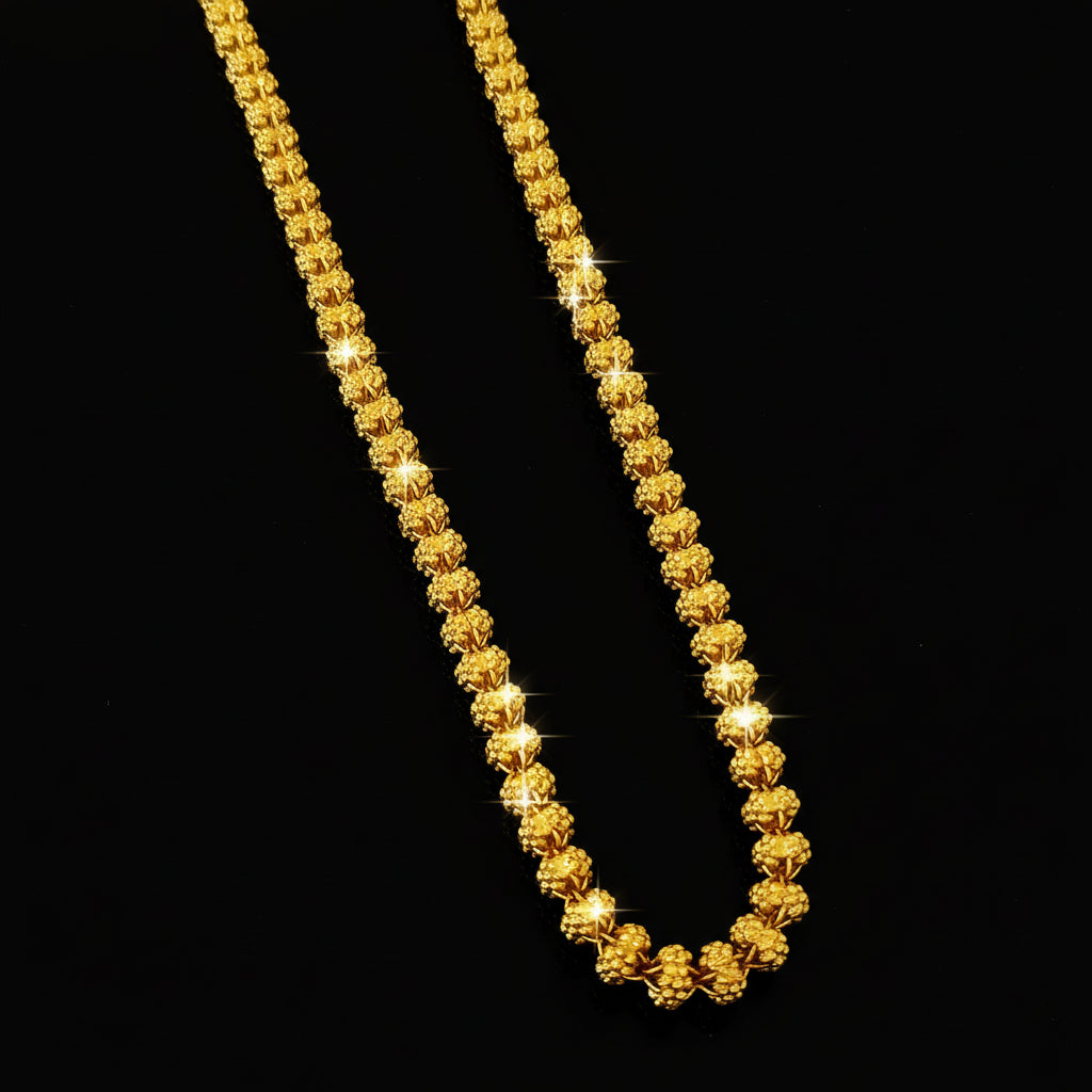 Gold chain necklace on a gray background with 'SAHELI' branding.