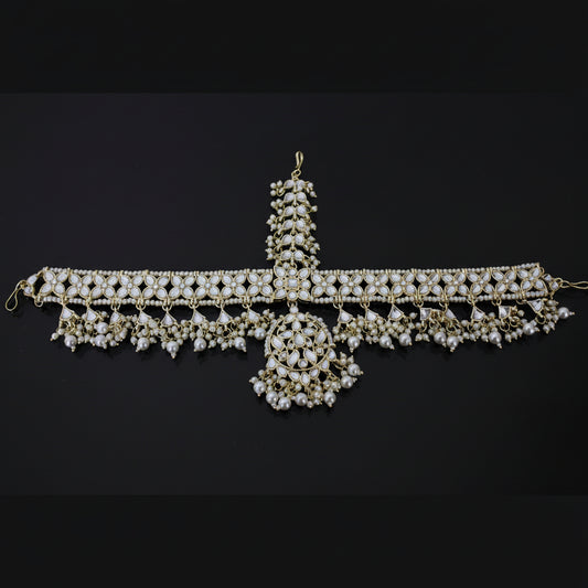 Decorative necklace with pearls on a dark background, branded 'Saheli'.