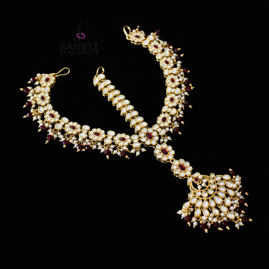 Jewelry set with necklace and earrings on a dark background, featuring the brand 'Saheli'.