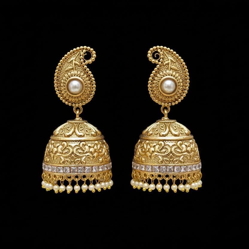 Pair of gold earrings with pearl accents on a black background