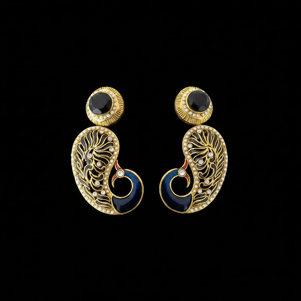 A pair of gold-plated chandbali earrings with dark blue enamel, black stones, and small white stones, displayed on a reflective gray surface with the SAHELL MY BEST FRIEND logo at the top.