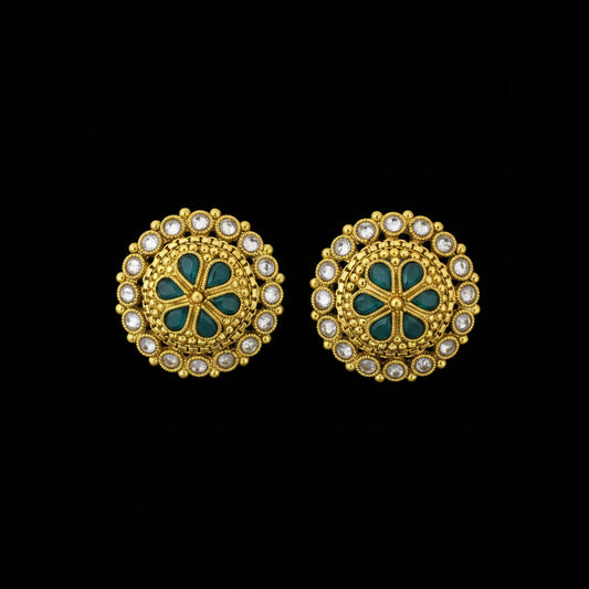 Gold and green earrings with 'SAHELI' branding on a dark background