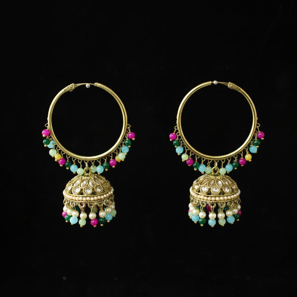 Pair of gold hoop earrings with colorful beads on a black background