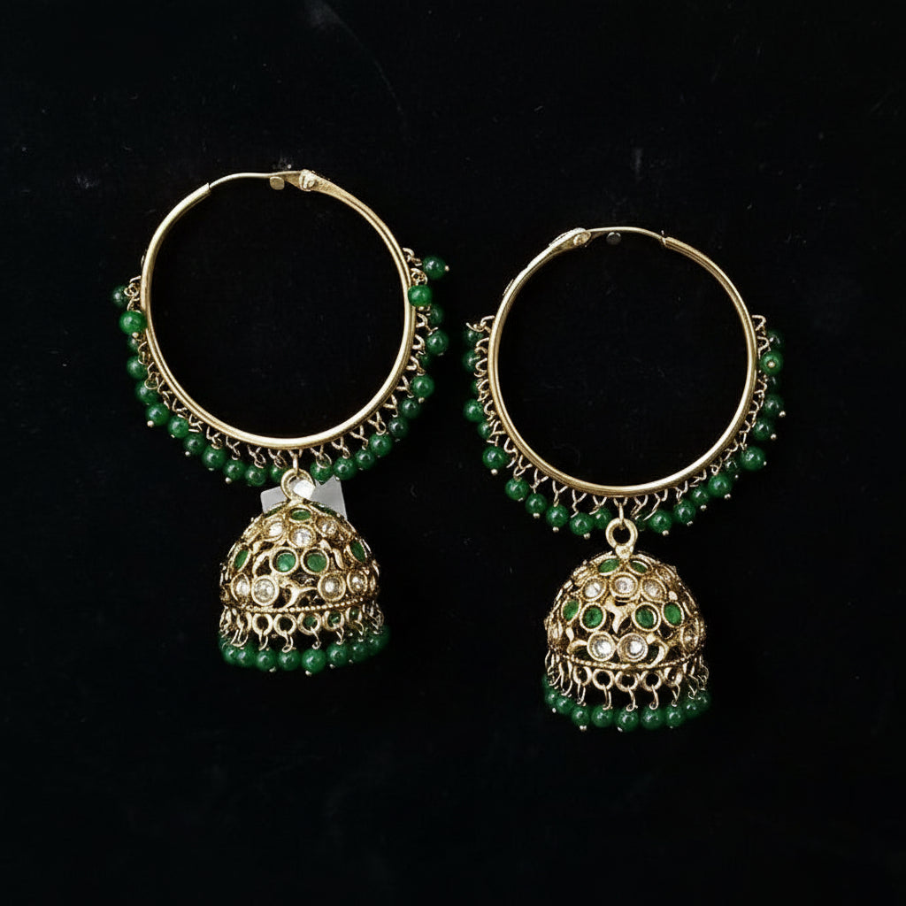 Gold hoop earrings with green beads and jhumki designs on a black background, branded 'SAHELHI'.