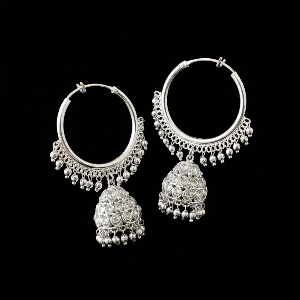 Silver hoop earrings with dangling elements on a black background, featuring the brand 'Sahell'.