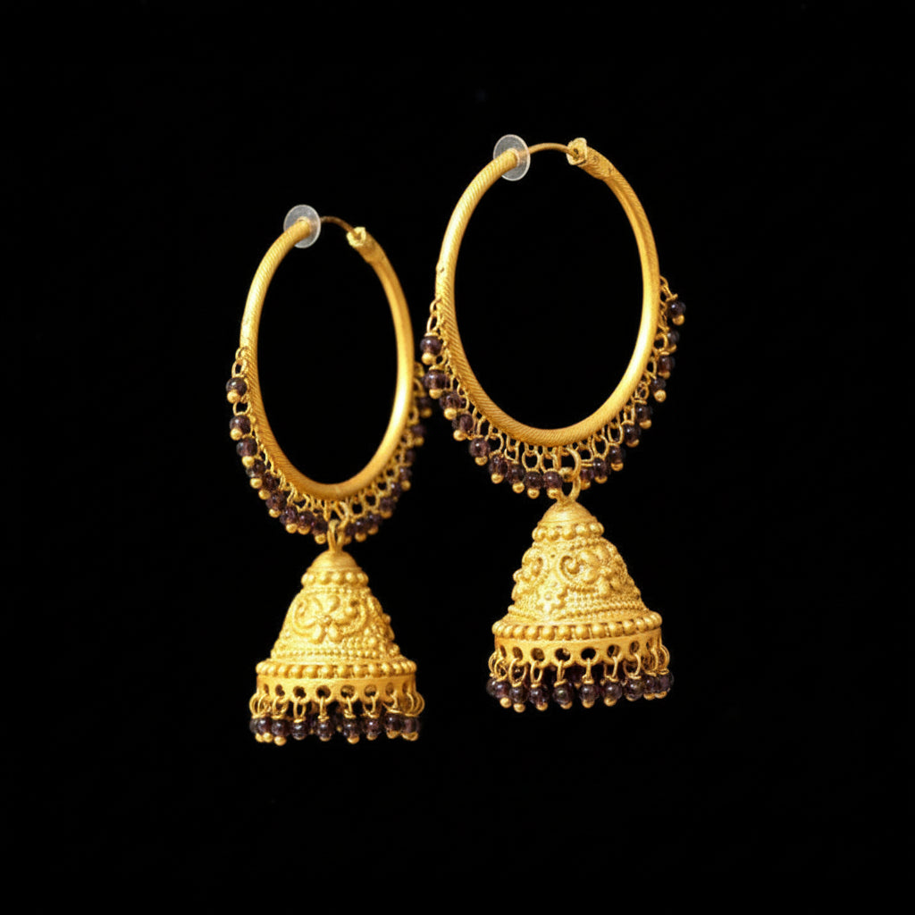 Gold hoop earrings with jhumkas on a black background, featuring the brand 'Saheli'.